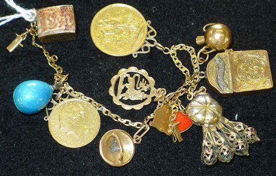 Yellow metal bracelet hung with Victorian sovereign, etc.